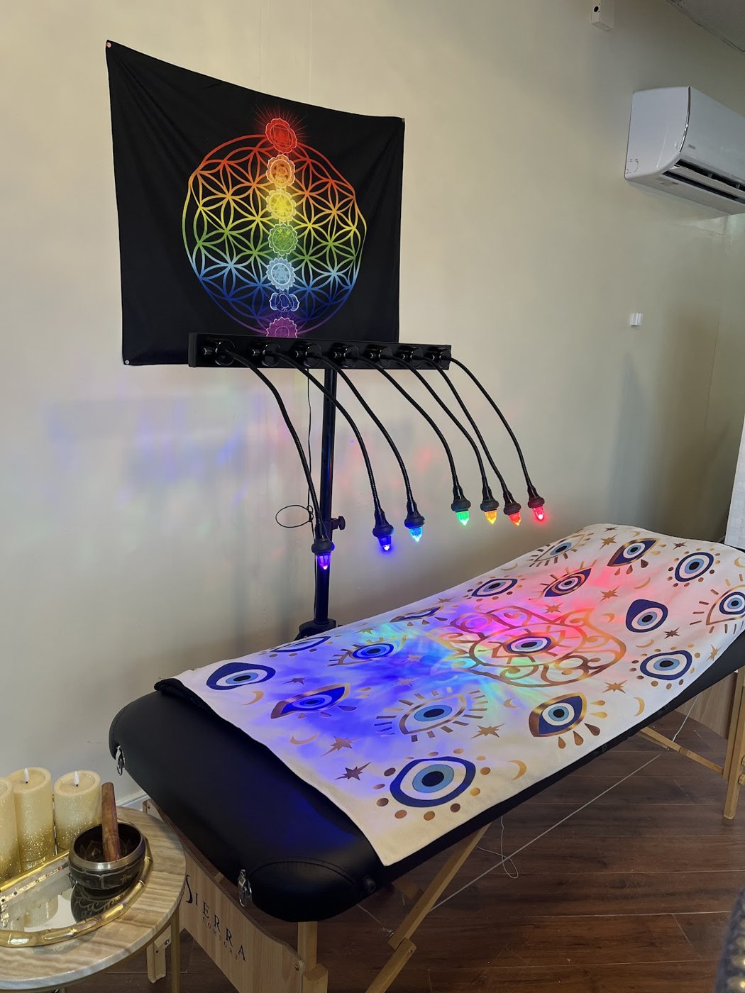 The healing table under the chakra lights at Psychic Visions