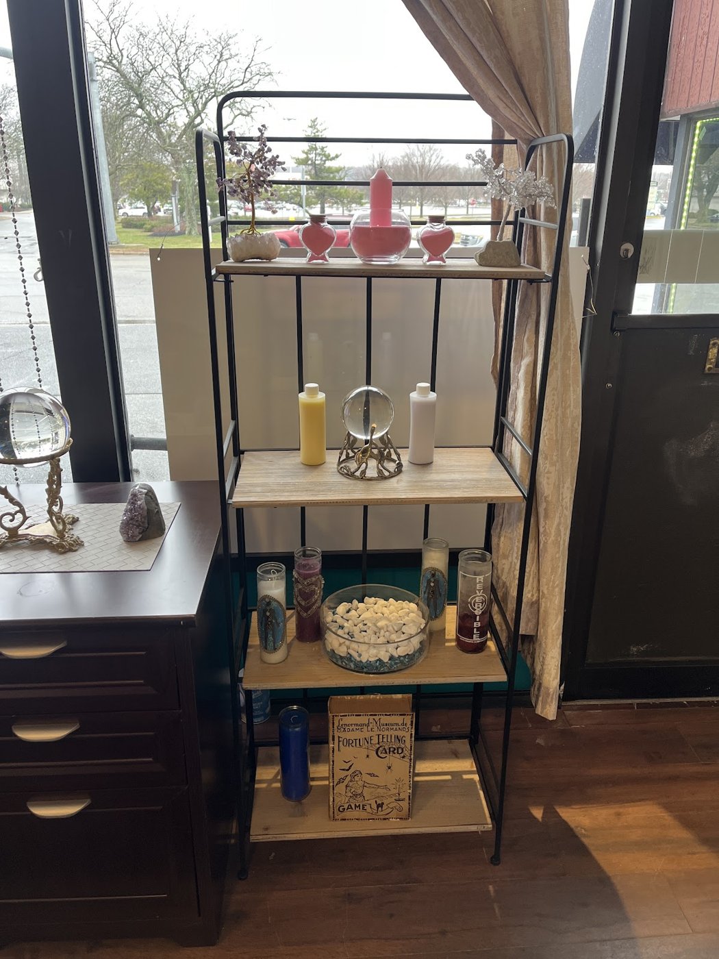 Crystals, candles and oils on the shelf